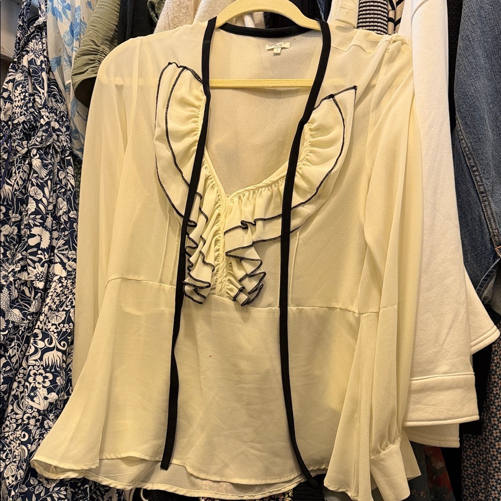 Chic Cream Ruffle Blouse with Black Trim